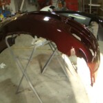 Before and after photographs of a damaged Porsche that was repaired by Elite Paint & Body Shop in West Palm Beach, Florida.